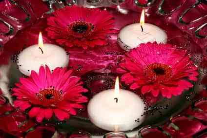 candles and flowers in water