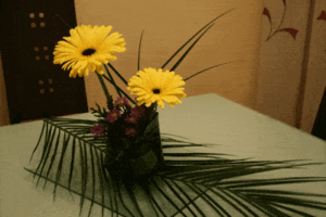 centro de mesa gerberas sobre cristal